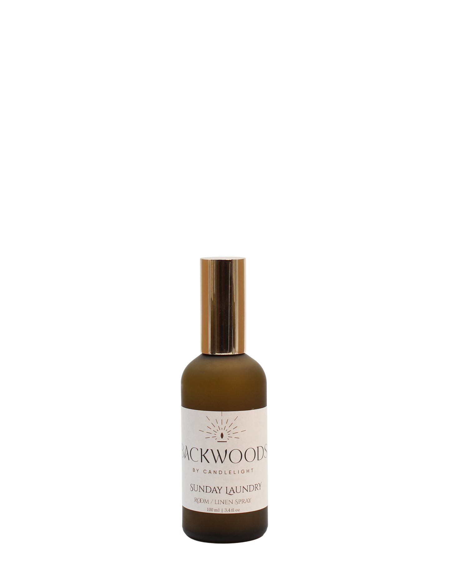 Brown spray bottle with gold cap labeled 'Backwoods by Candlelight Sunday Laundry' on a white background