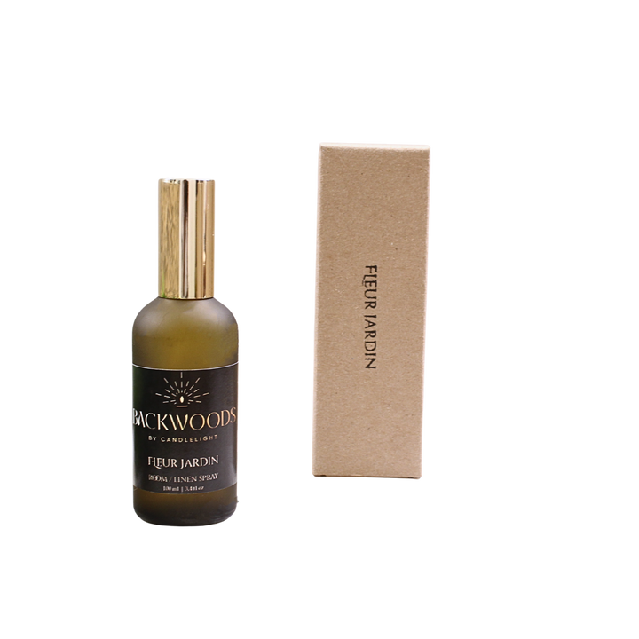 Bottle and box of Backwoods by Candlelight Fleur Jardin product on a white background