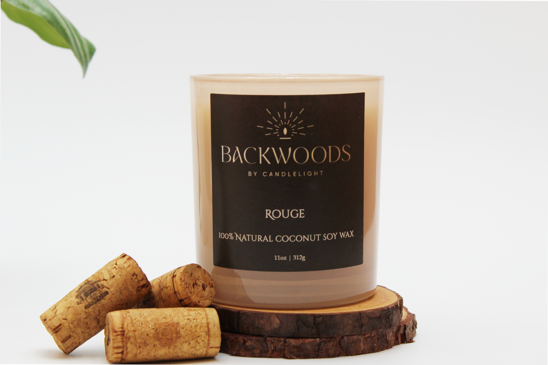 Backwoods By Candlelight all natural candle, non-toxic candle. Rouge front label with corks, leaf, wooden wick and candle coaster.