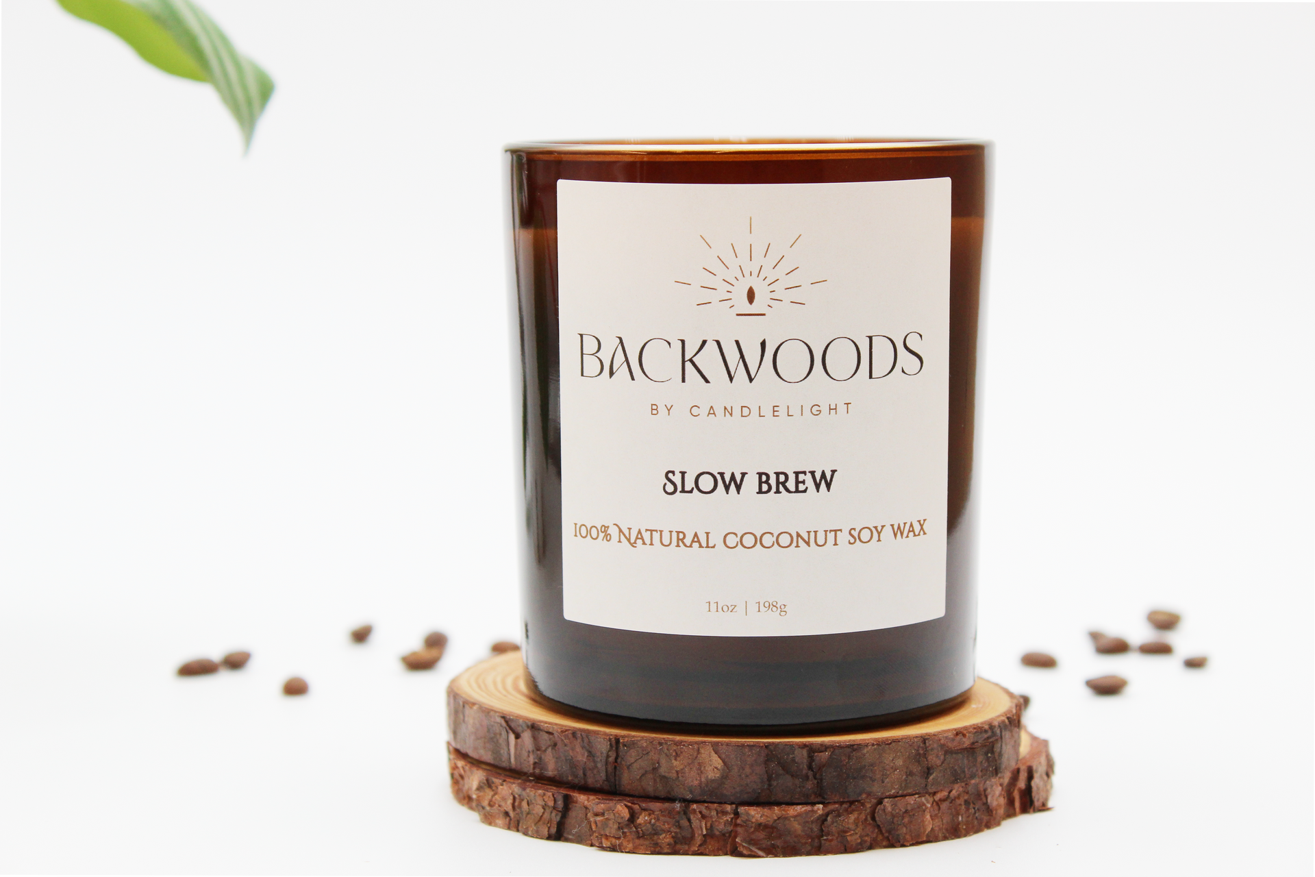 Backwoods By Candlelight all natural candle, non-toxic candle. Slow Brew front label with coffee beans, leaf, wooden wick and candle coaster.